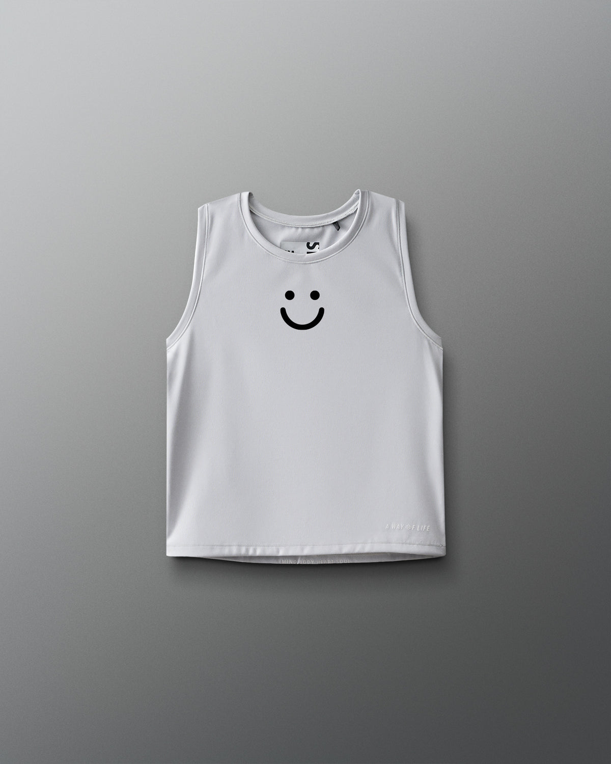 White tank top with a smiley face design on a gray background