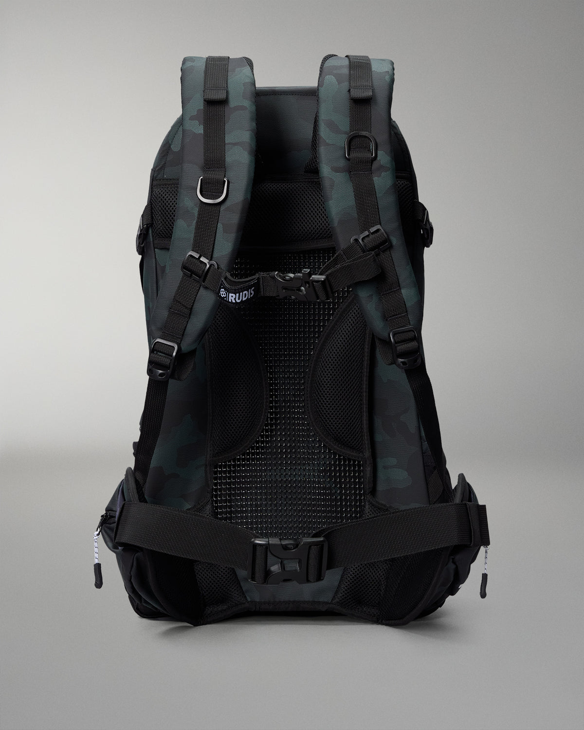 Green Camo and gray camouflage backpack on a gray background