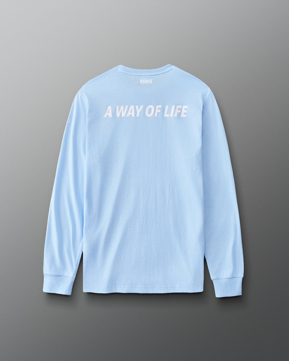 Back view of the light blue RUDIS Elite Super Soft Long Sleeve featuring white “A WAY OF LIFE” lettering and RUDIS branding below the collar.