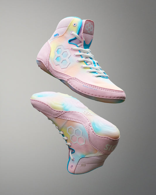 Pastel-colored Wrestling shoes on a gray background