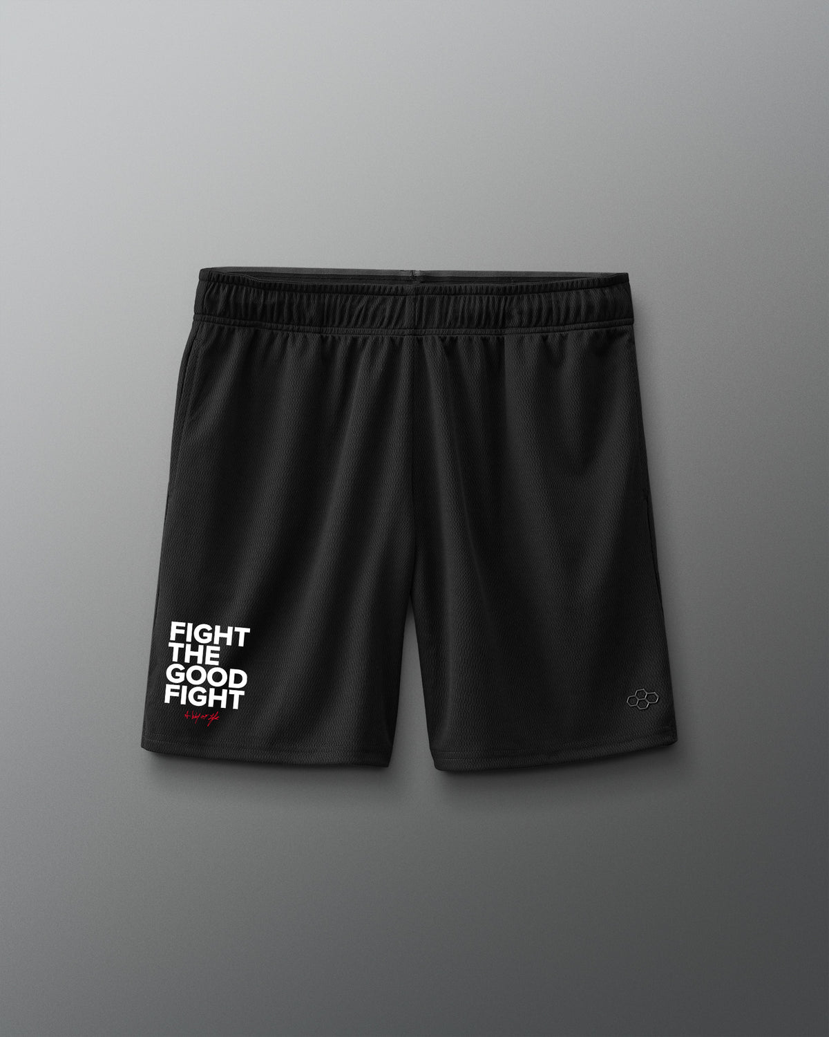 Black shorts with 'Fight the good fight' text on a gray background