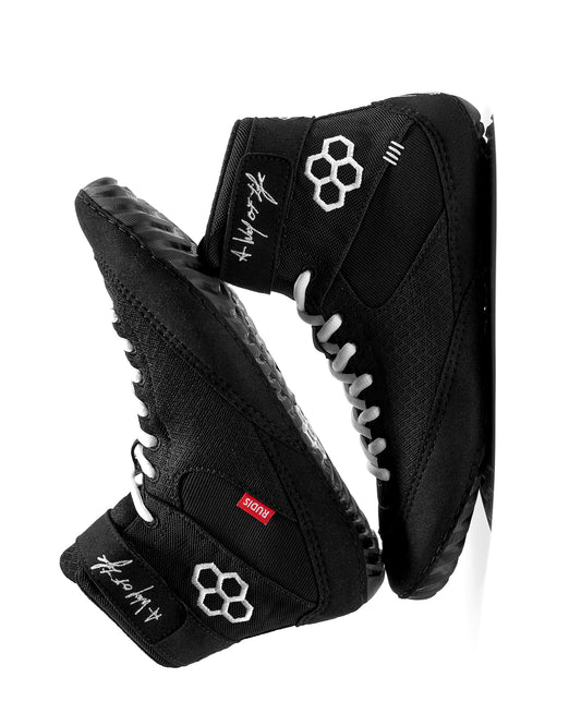 Black wrestling shoes with white laces and branding on a white background