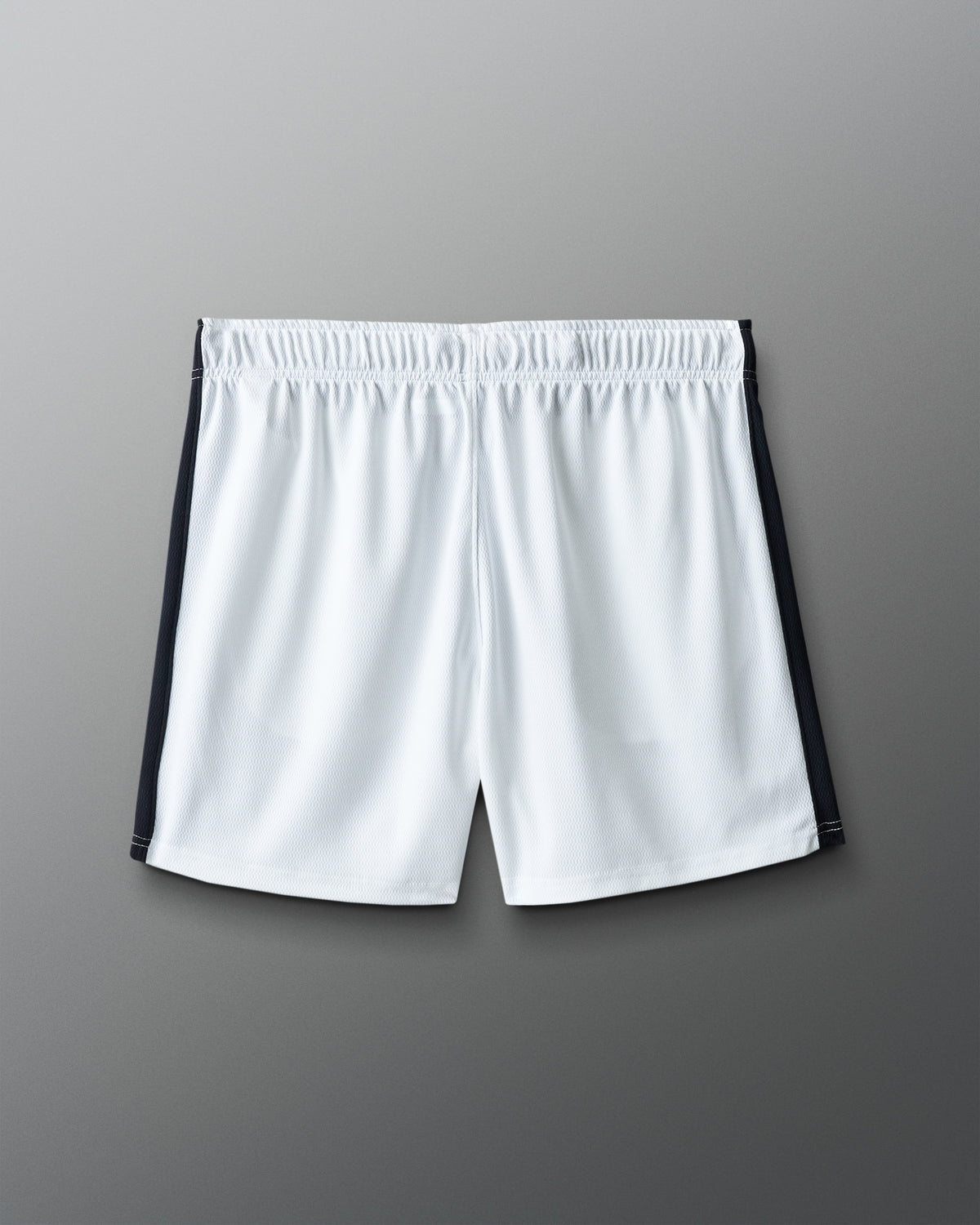 White shorts with black accents on a gray background