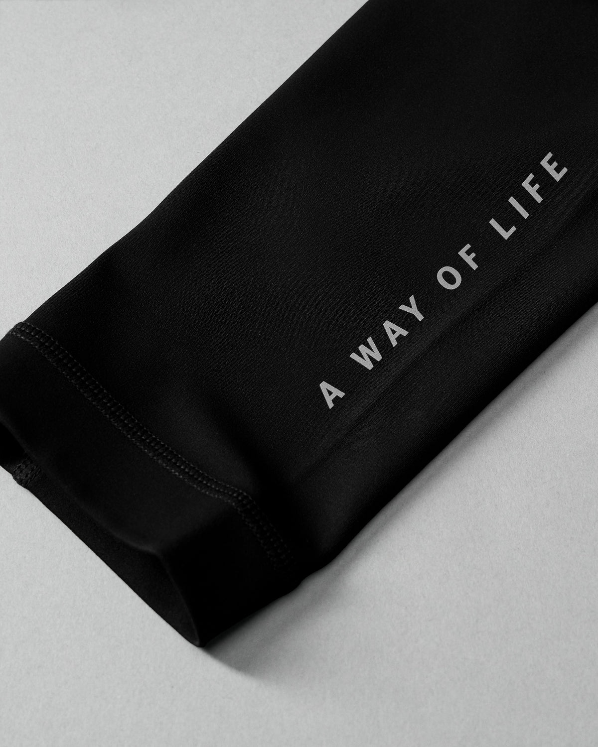 Black fabric with 'A Way of Life' text on a light gray background