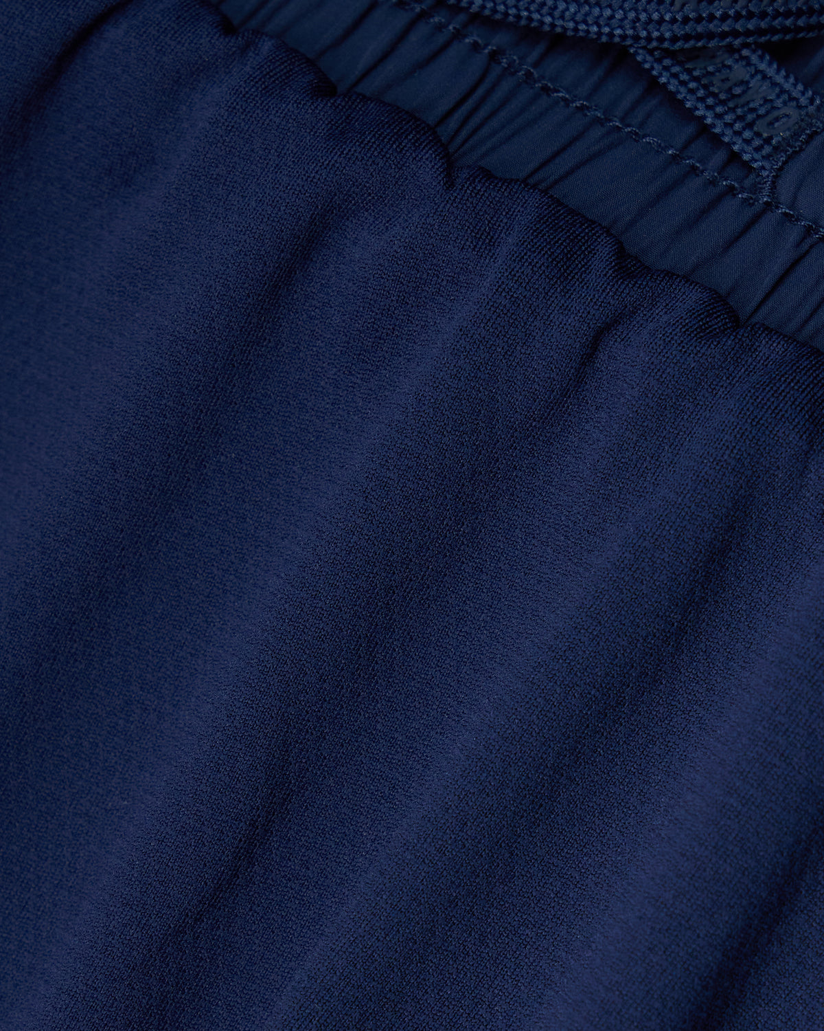 Close-up of dark blue fabric with a textured pattern