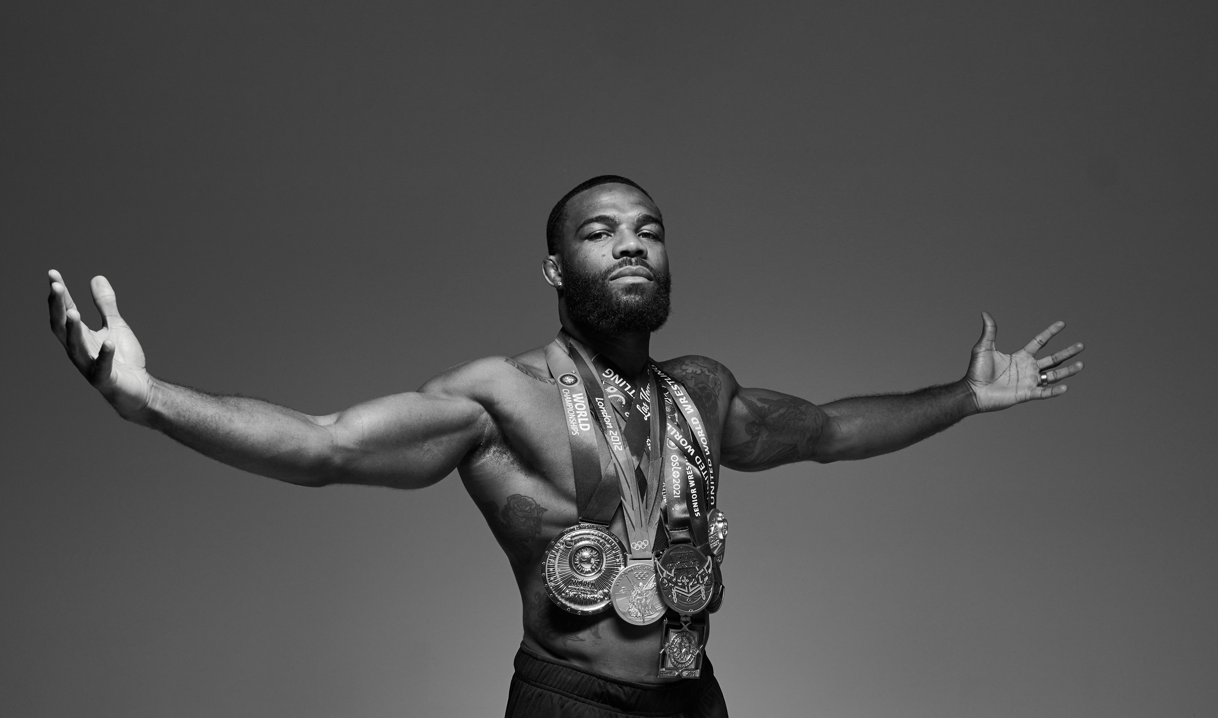 Jordan Burroughs Olympic champion wrestler wearing multiple gold medals, JB1 wrestling shoes by RUDIS athlete and world champion