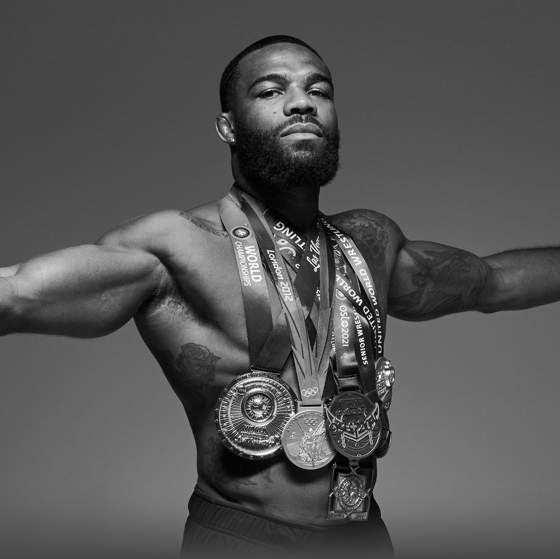 Jordan Burroughs Olympic champion wrestler wearing multiple gold medals, JB1 wrestling shoes by RUDIS athlete and world champion