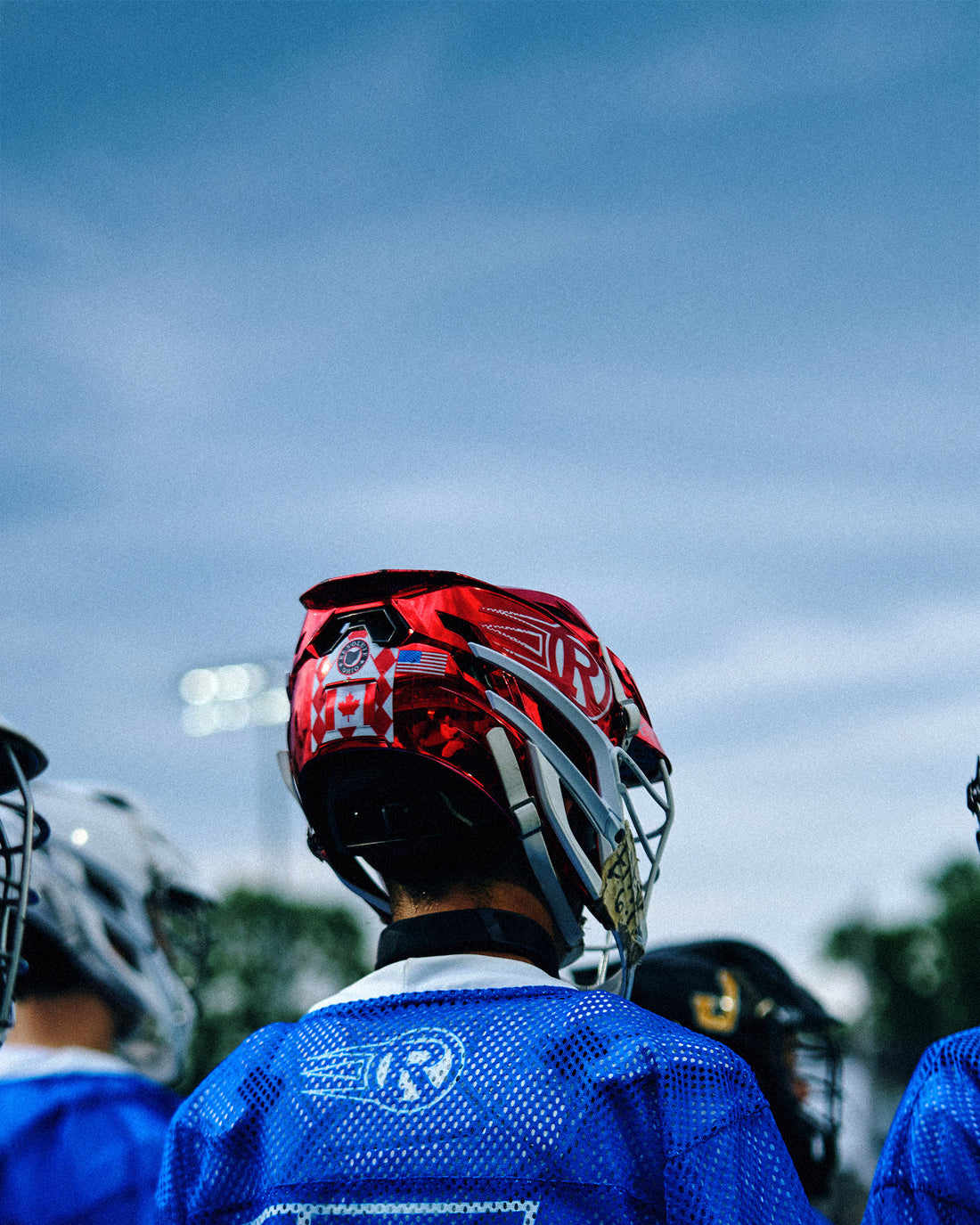 Athlete wearing Resolute Lacrosse × RUDIS performance apparel and lacrosse equipment before practice, highlighting elite competition and team training.