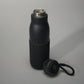 A sleek black insulated water bottle with a textured grip and a detachable lid designed for stylish hydration on the go