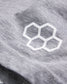 A close-up view of a light gray fabric featuring a white hexagonal logo highlighting the texture and detail of the material