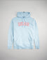 This image presents a light blue hoodie featuring the word RUDIS prominently displayed in bold red letters designed for casual and athletic wear