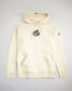 A cream-colored hoodie featuring the phrase a way of life printed in bold black text on the front and a logo on the sleeve