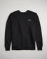 A black crewneck sweatshirt featuring a small stylized hexagon logo on the left chest area showcasing a clean and minimalist design