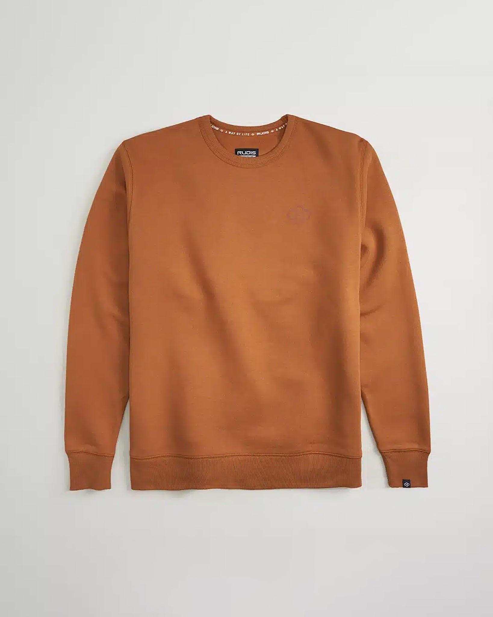 This image displays a casual brown sweatshirt with a simple design featuring a crew neck and ribbed cuffs presented against a neutral background