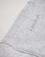 A close-up view of a light gray fabric with the phrase A WAY OF LIFE printed in a subtle design along the side