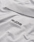 A close-up view of a light gray polo shirt featuring a black RUDIS logo on the collar area emphasizing a stylish and sporty aesthetic