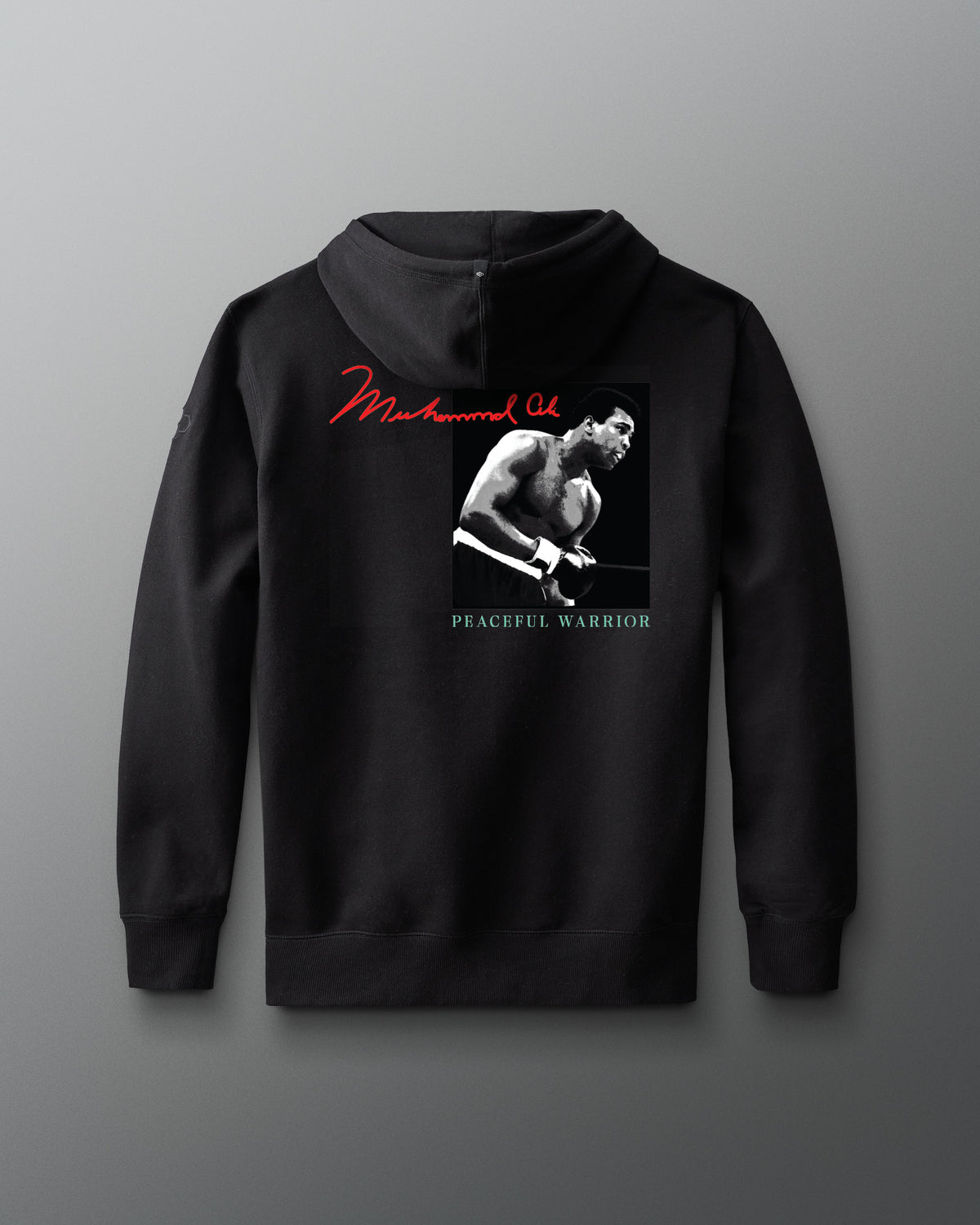 Black hoodie with a graphic of muhammad ali and text on a gray background