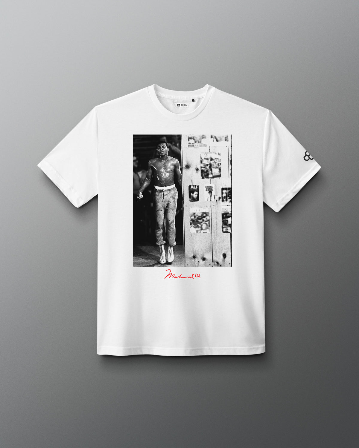 RUDIS Ali The Greatest Elite Supersoft T-Shirt in white, featuring a black-and-white Muhammad Ali training image, red signature detail, and RUDIS Hex sleeve branding.