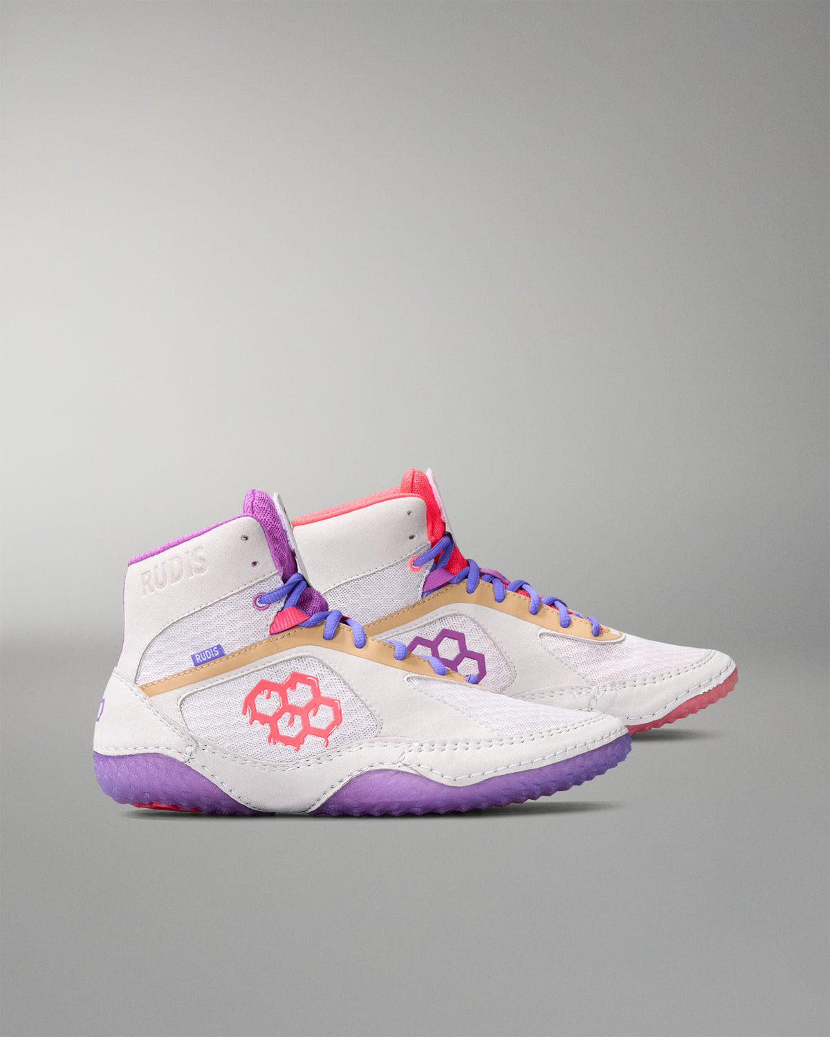 White wrestling shoe with purple, pink, and gold accents on a gray background