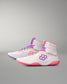 Pair of white wrestling shoe with pink and purple accents on a gray background