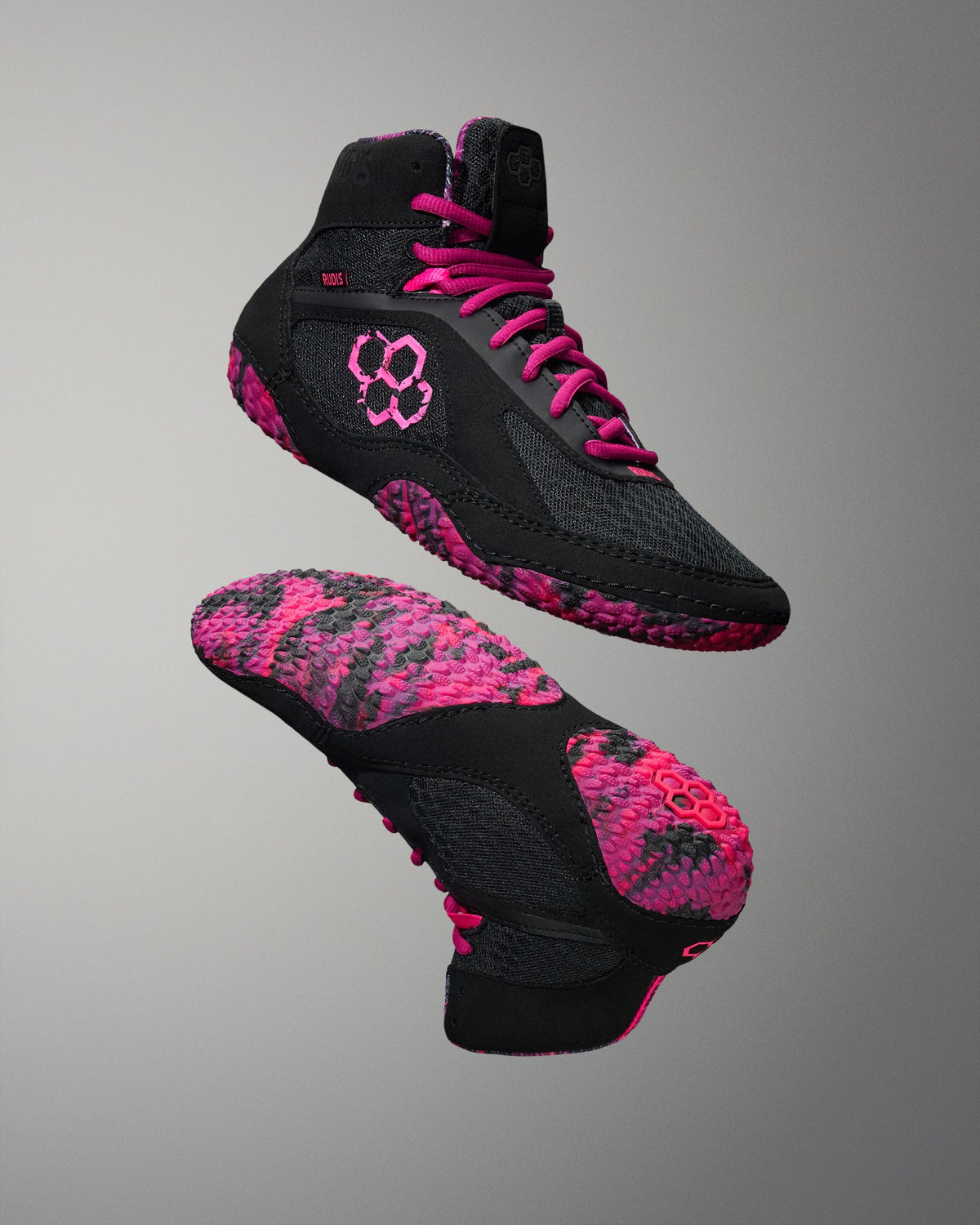 RUDIS Alpha 2.0 Pink Power wrestling shoes in black and vibrant pink, featuring a high-top design, lightweight construction, and advanced sole grip engineered for elite wrestling performance.