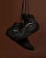 RUDIS Alpha 2.0 wrestling shoes in Terrain colorway with blacked-out design and rugged detailing, emphasizing durability, grip traction, and controlled mat performance