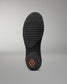 Black sole of a shoe with a textured pattern on a gray background