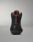 Black and orange boot with visible branding on a gray background