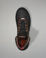 Black athletic shoe with camouflage pattern on a gray background