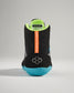 A back view of a black athletic shoe featuring a textured blue sole bright green lining and vibrant orange branding showcasing modern design elements for optimal performance