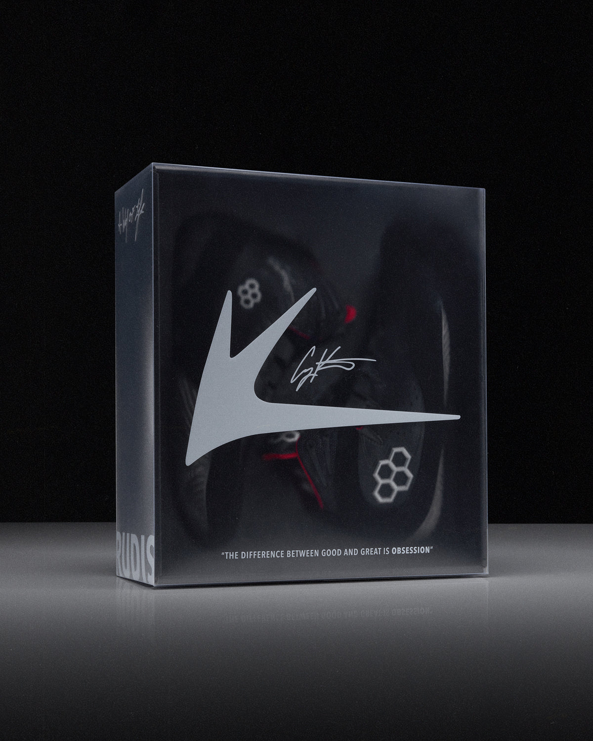Box with a wrestling shoe and 'RUDIS' brand logo on a black background - Cary Kolat wrestling shoes