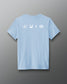 Light blue t-shirt with white icons on the back against a gray background