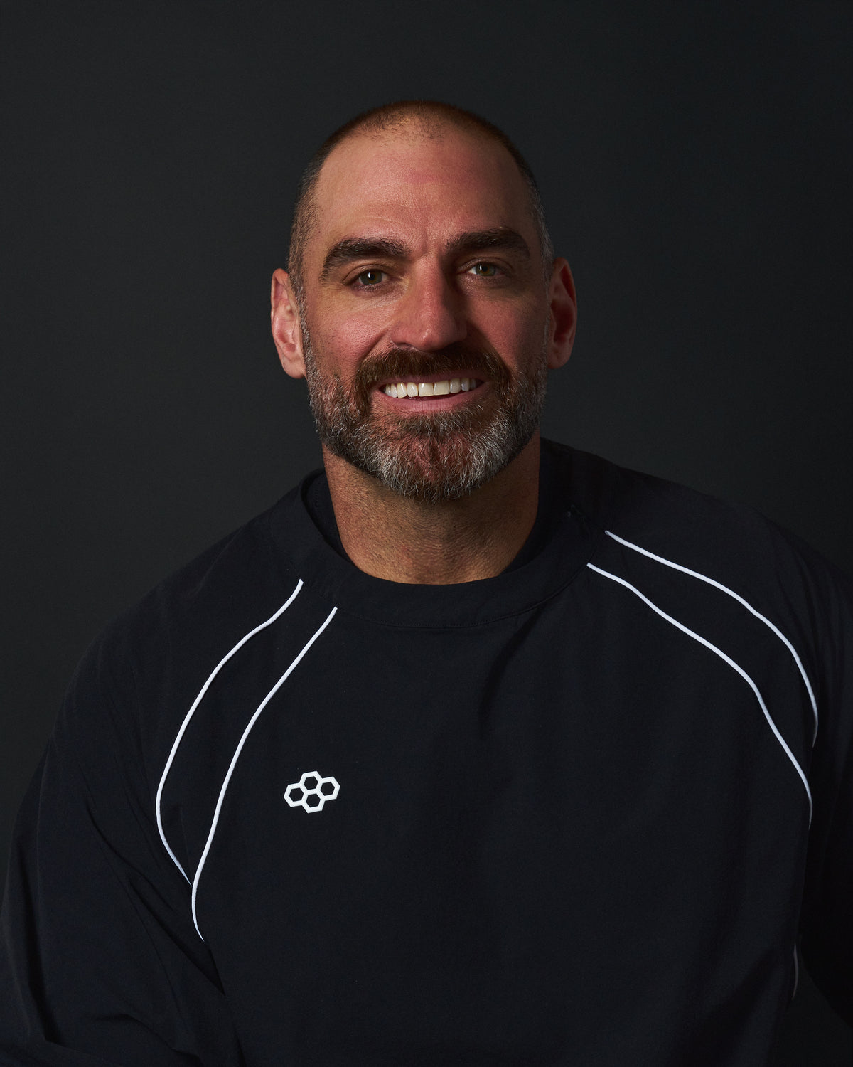 Anthony Kelly, co-founder of Resolute Lacrosse, wearing RUDIS performance apparel as part of the Resolute Lacrosse × RUDIS partnership.