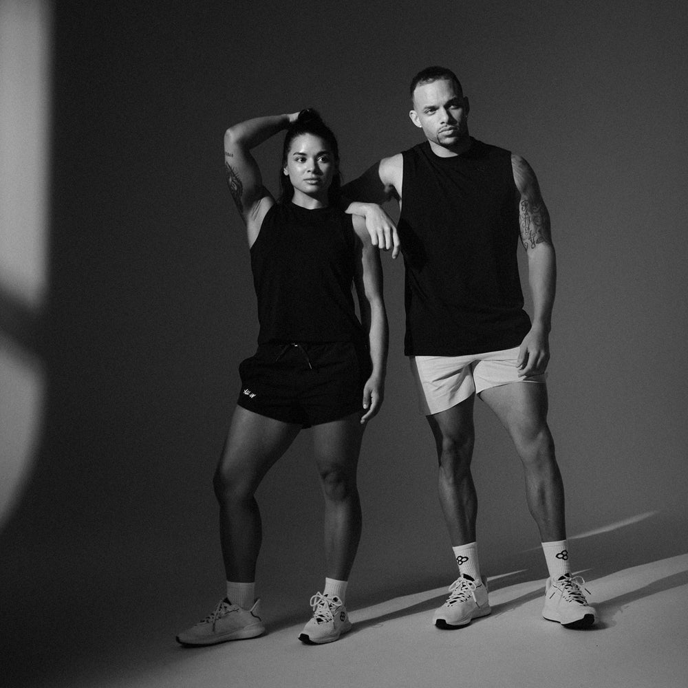 Male and female athletes wearing RUDIS performance apparel, showcasing premium activewear designed for training, competition, and everyday athletic performance.