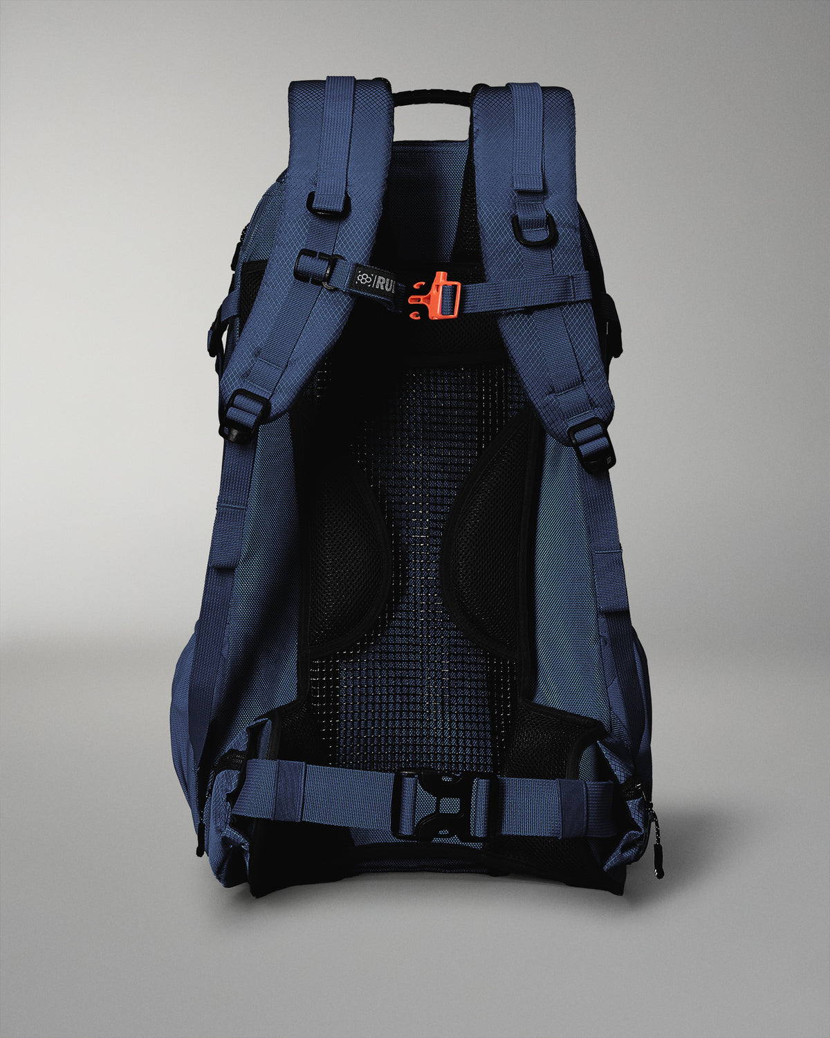 Blue backpack with black interior on a gray background