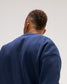 Close-up rear view of the RUDIS Penn State Map Relaxed Comfort Fleece Crewneck in Navy, highlighting the solid navy back, relaxed shoulders and subtle RUDIS neck logo.