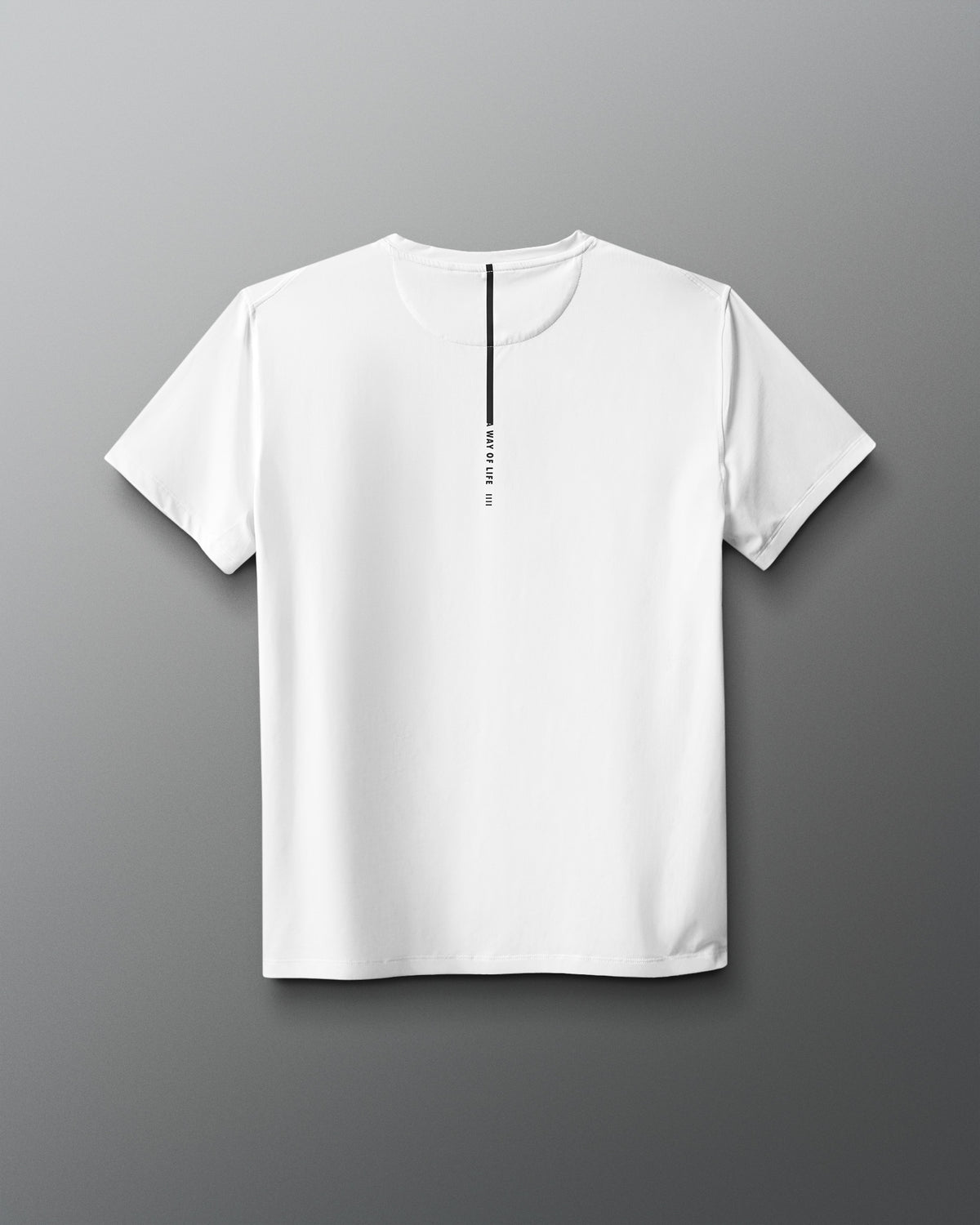 White t-shirt with a small black logo on a gray background