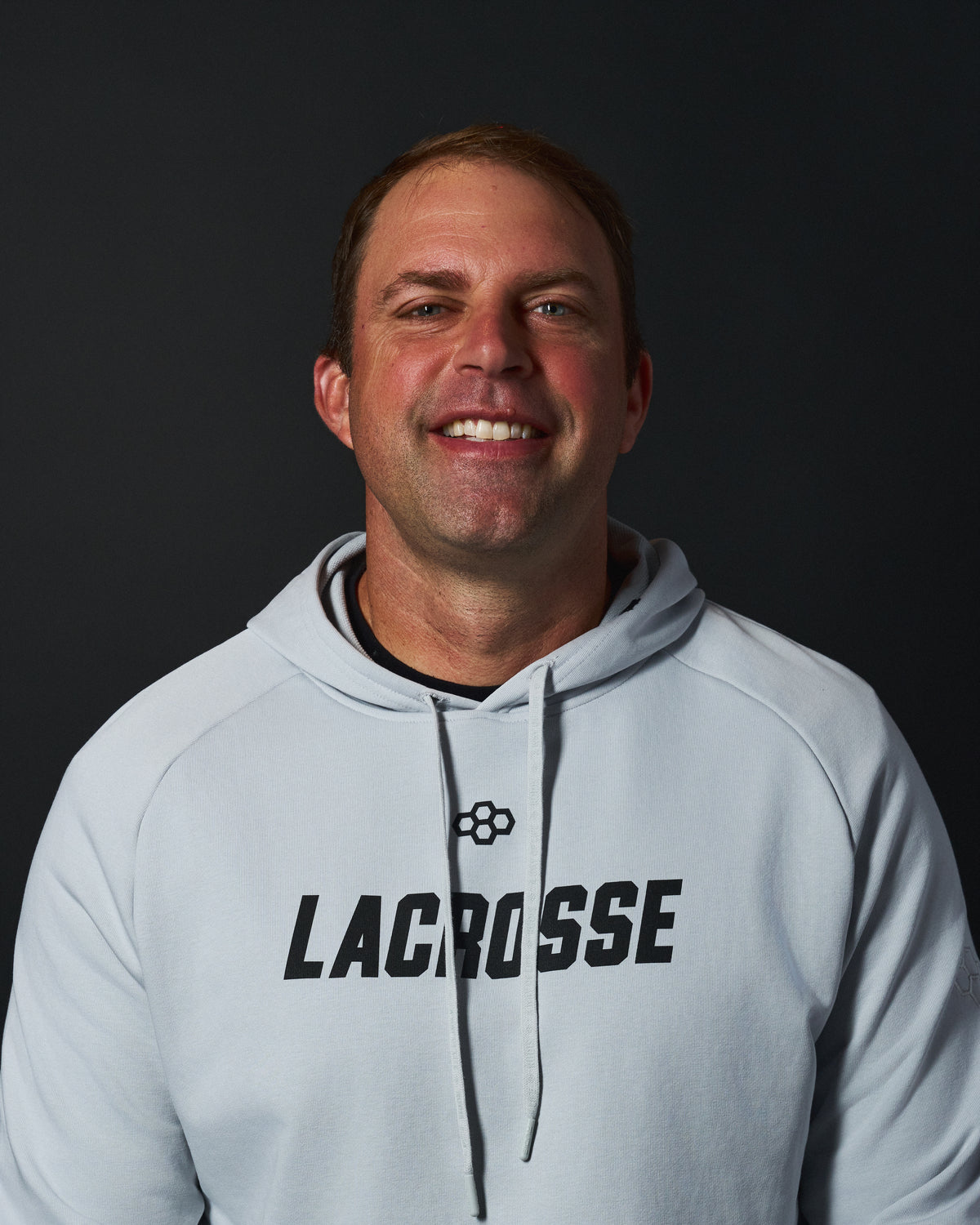 Greg Bice, co-founder of Resolute Lacrosse, wearing RUDIS performance apparel as part of the Resolute Lacrosse × RUDIS partnership.