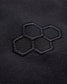 An intricate embroidered logo featuring three hexagons on a textured black fabric background highlighting a modern and minimalistic design approach