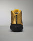 A striking gold and black athletic shoe showing a sleek design with the phrase ALL SEE IS GOLD printed at the back