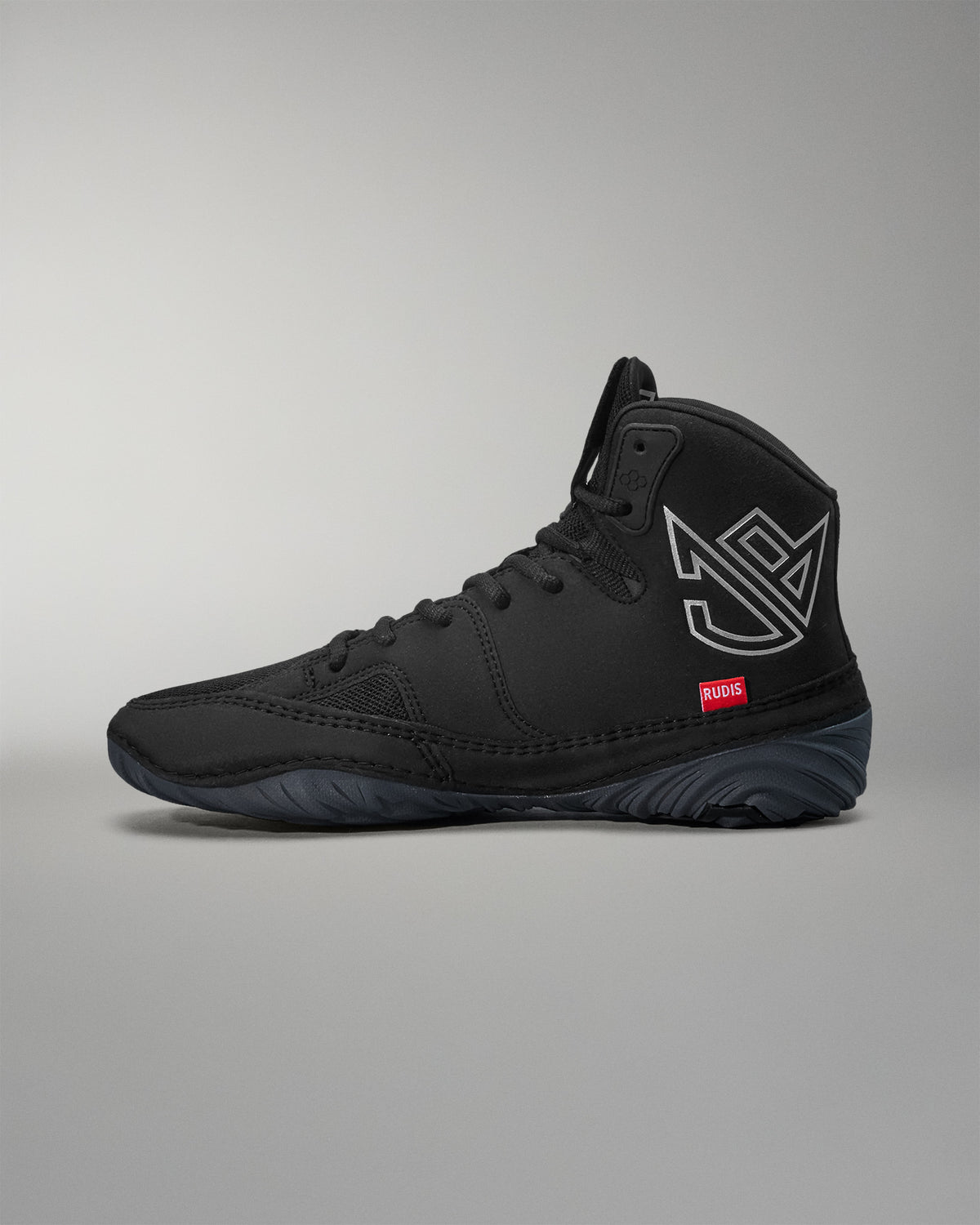 Black Jordan Burroughs wrestling shoes with a logo on a gray background