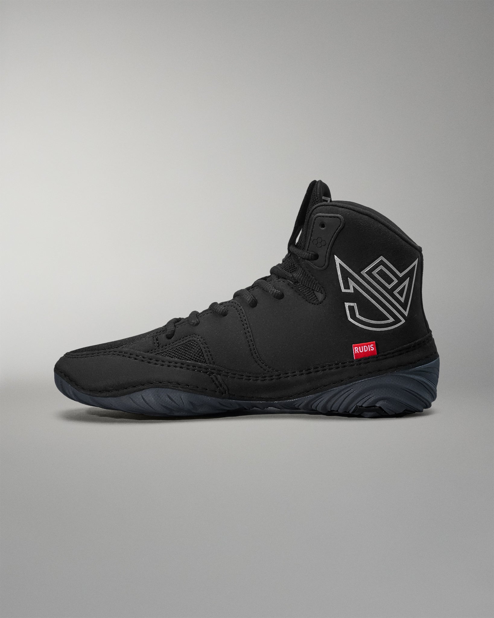Black Jordan Burroughs wrestling shoes with a logo on a gray background