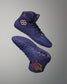 Blue wrestling shoes with brand logos on a gray background