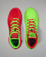 Red and green Wrestling shoes with bright green laces on a gray background