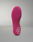 Close-up of a pink Wrestling shoe sole with a textured pattern on a gray background