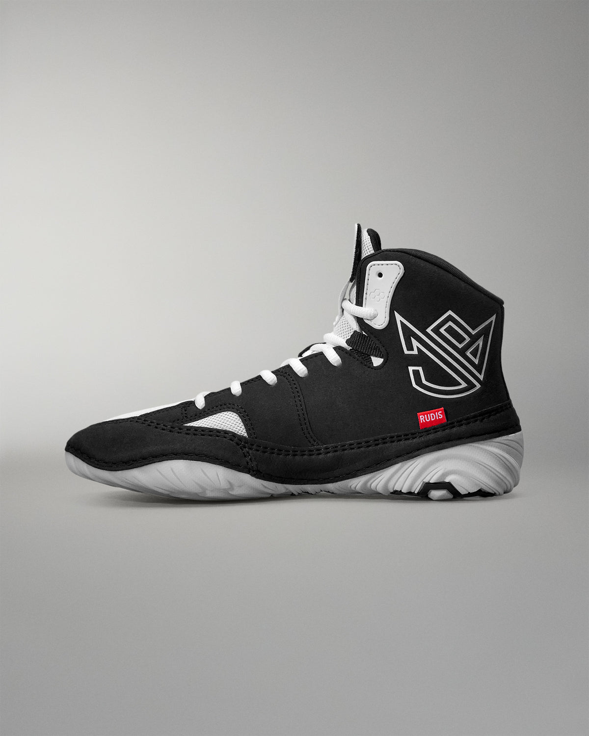 Black Jordan Burroughs Wrestling shoes with white accents on a gray background