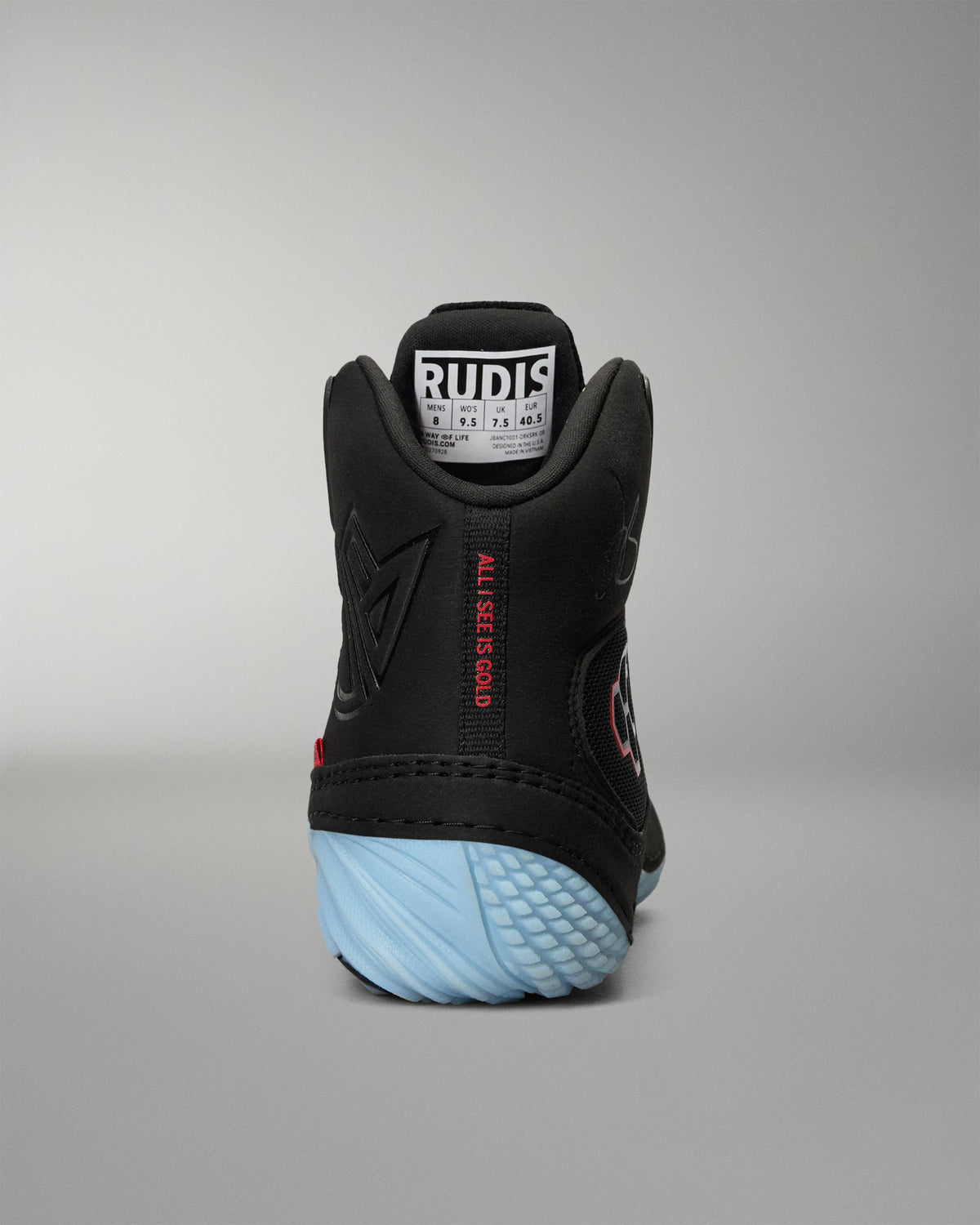 RUDIS JB1 Adult Wrestling Shoe in Dark Shark shown from the rear, featuring the padded high-top collar, tonal JB branding, red All I See Is Gold detail, and light blue heel outsole.