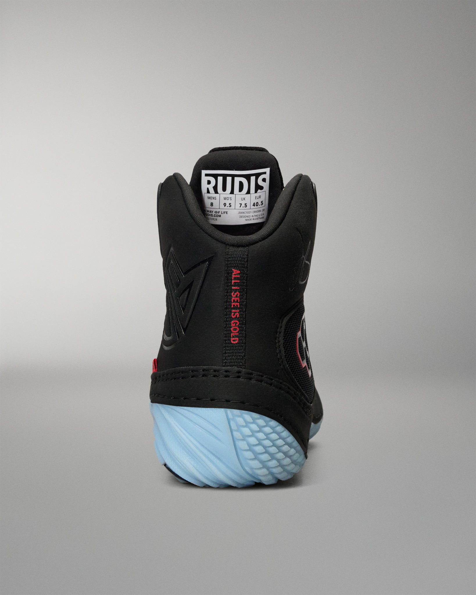 RUDIS JB1 Adult Wrestling Shoe in Dark Shark shown from the rear, featuring the padded high-top collar, tonal JB branding, red All I See Is Gold detail, and light blue heel outsole.