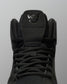RUDIS JB1 Adult Wrestling Shoe in Dark Shark shown in a close-up front view, highlighting the black lacing system, mesh tongue, padded collar, and tonal JB tongue logo.