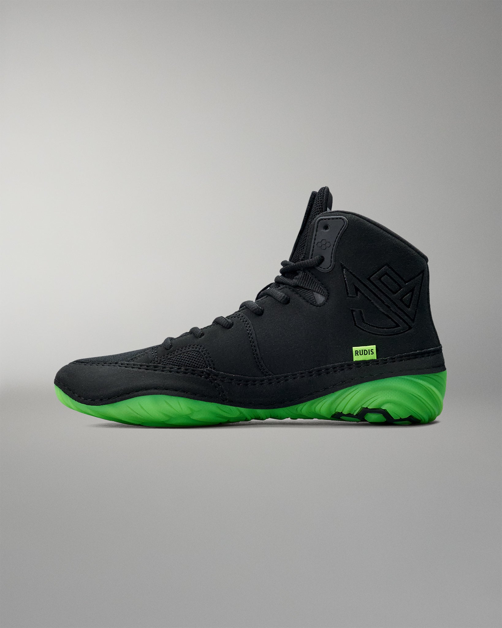 Black Wrestling shoe with green sole on a gray background